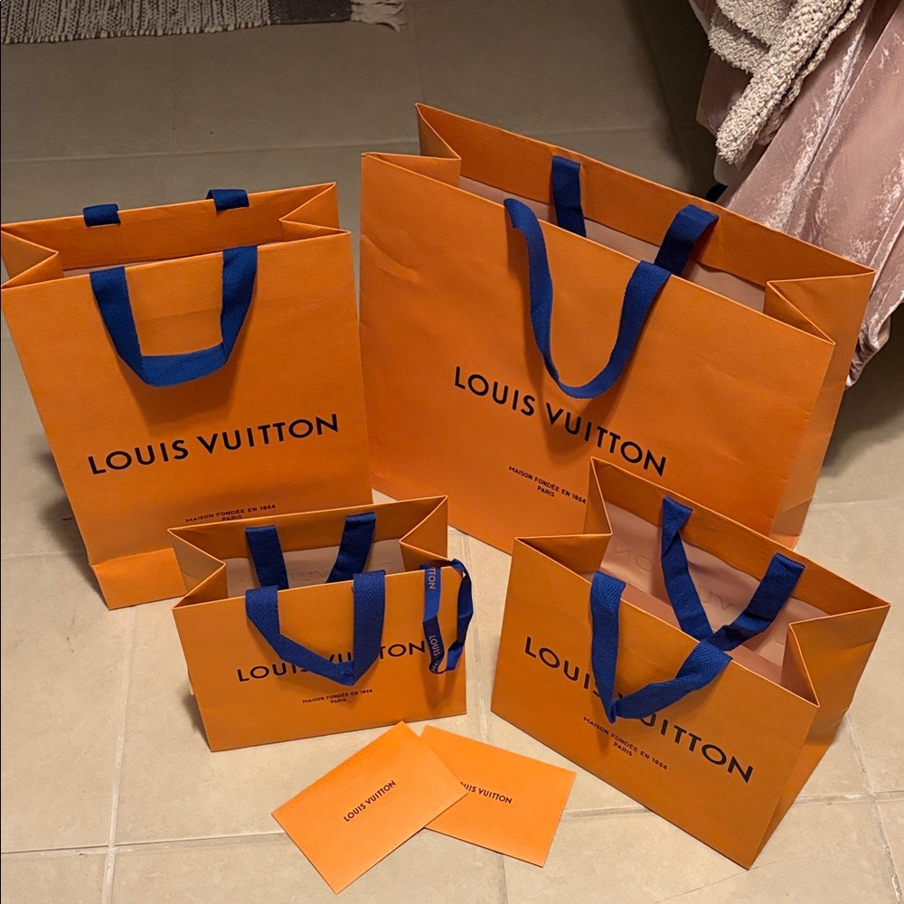 Louis Vuitton Bold Orange Bags with Blue Handles